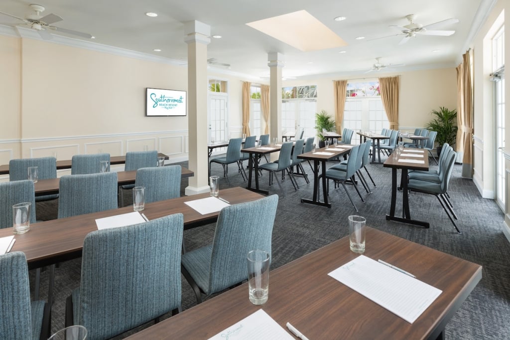Tables and chairs set up classroom style in the natural light-filled South Beach Room at Southernmost Beach Resort.