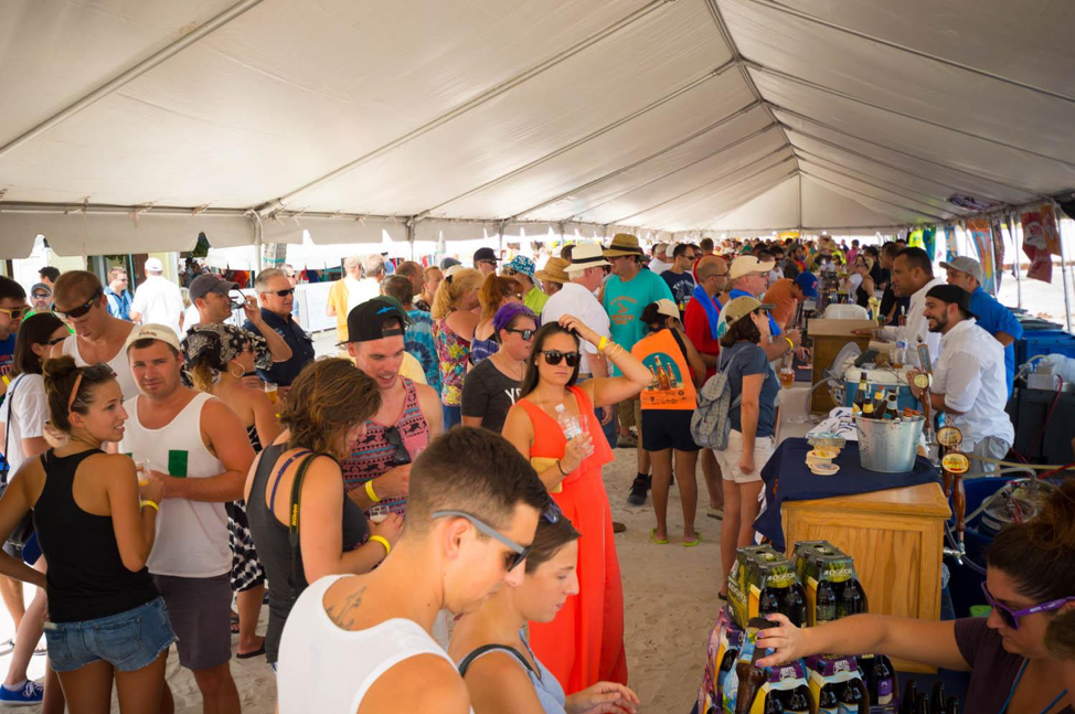 Guests enjoying themselves at the Brewfest tent.