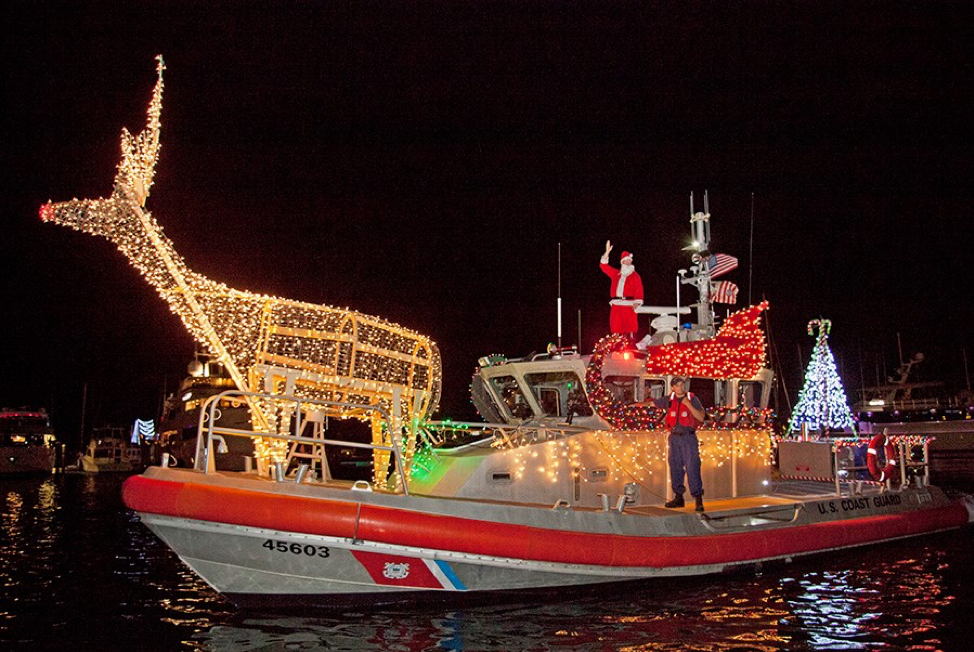 Participating boat in the Schooner Wharf Bar Lighted Boat Parade showing off their large large deer, sled and tree light structures.