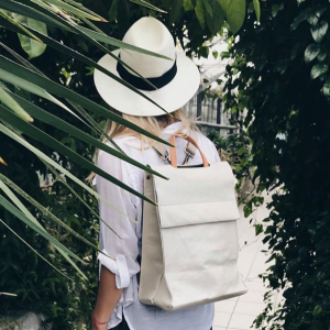 Woman walking through a lush tropical garden