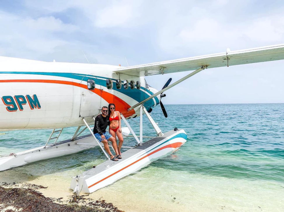 A couple learning against the Key West Seaplane