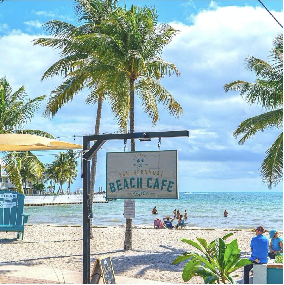 Southernmost Beach Cafe sign in-front of the beach.