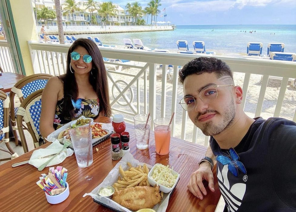 Couple enjoying the food and views from Southernmost Beach Cafe