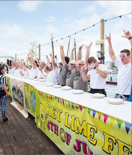 contestants cheering during World Key Lime Pie Eating Championship