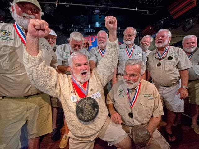 Group of men in khakis celebrating Hemingway Days