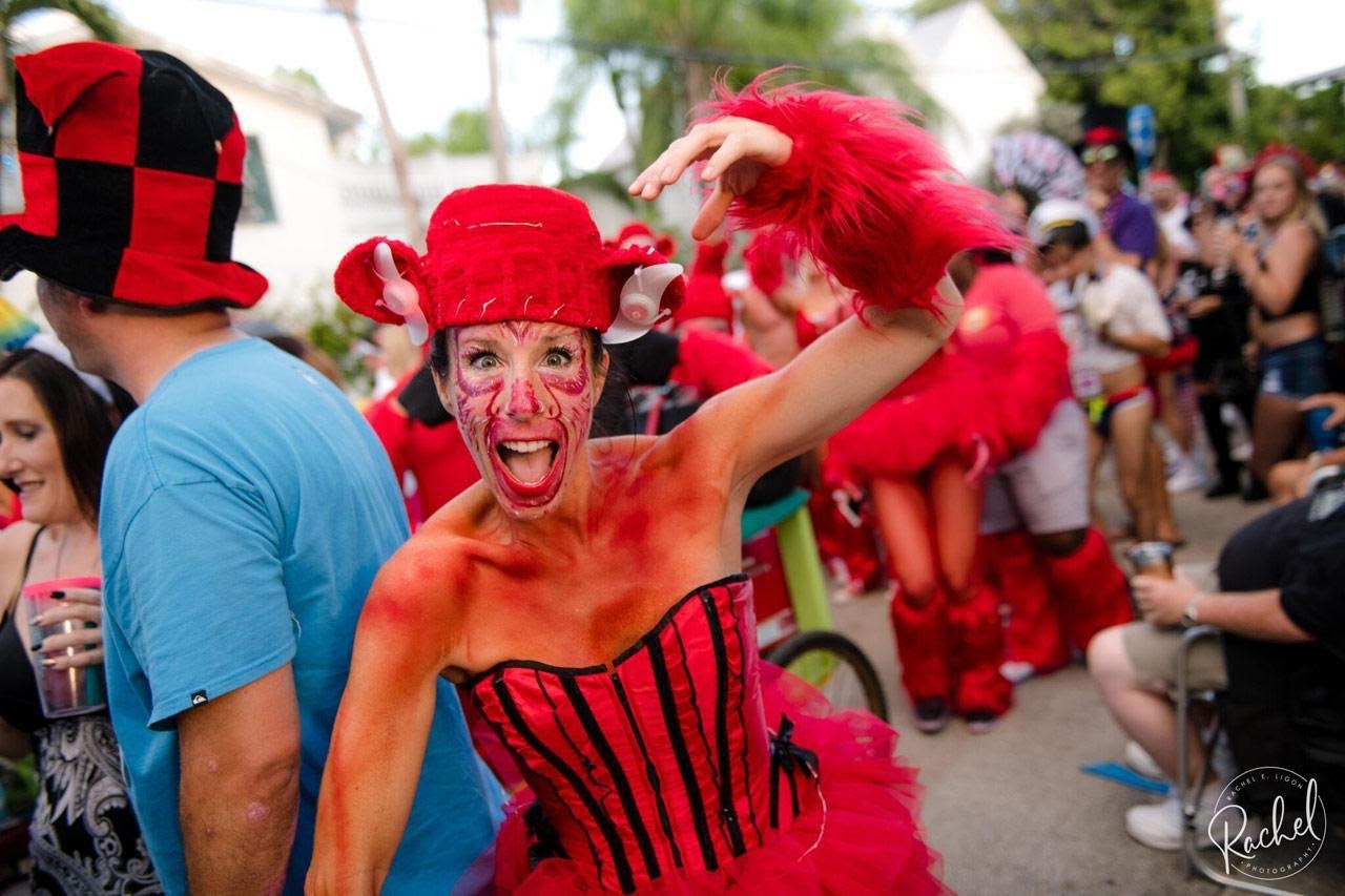 Woman wearing red costume during Fantasy Fest