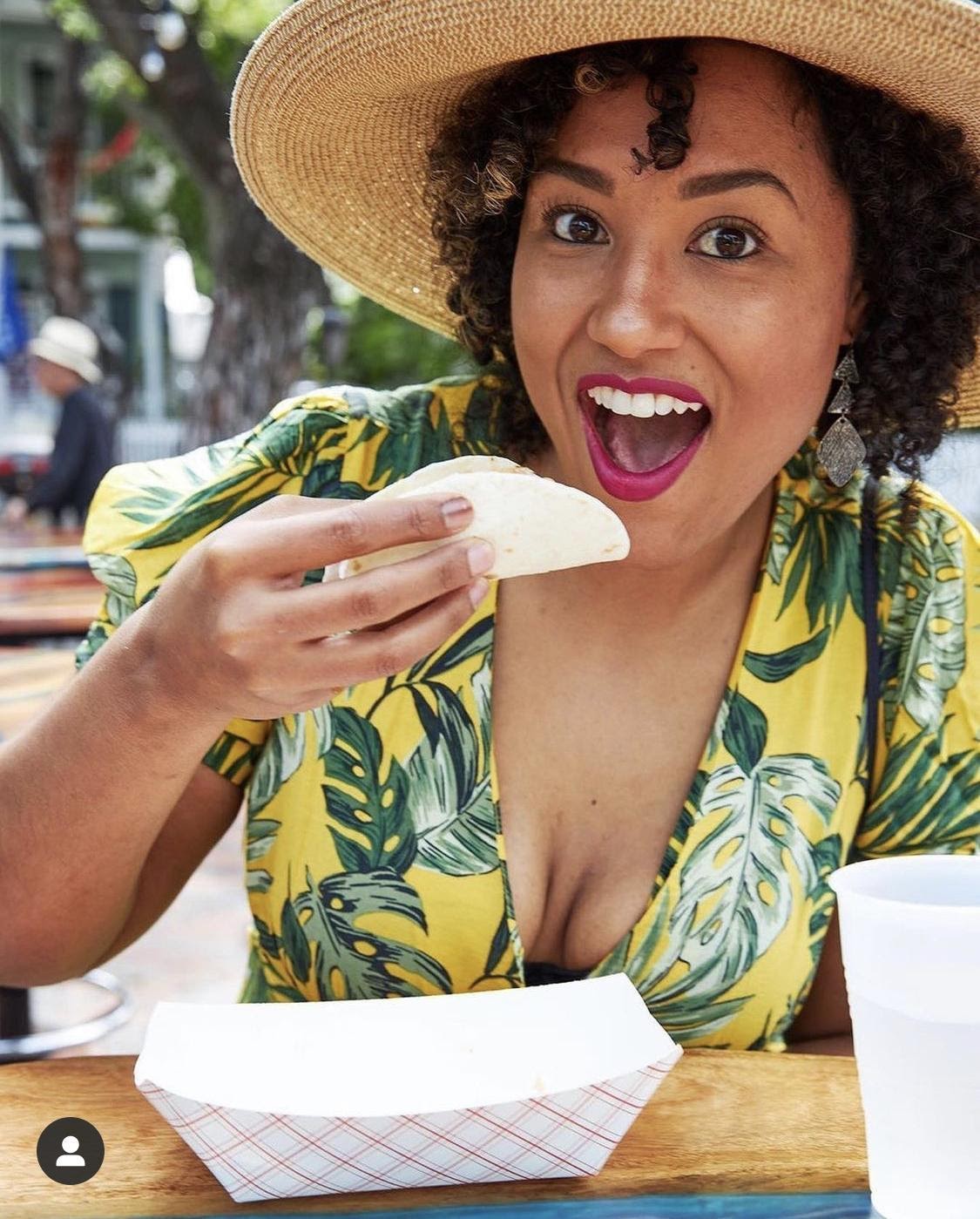 Woman enjoying a taco