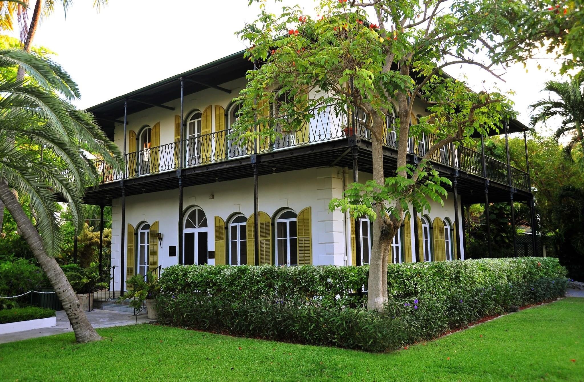 A museum surrounded by lush trees and grass