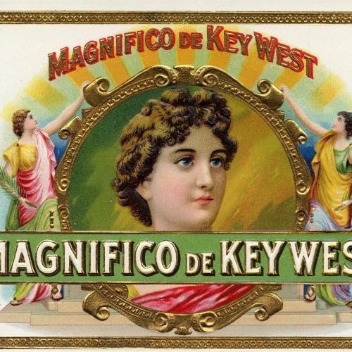 A large, ornate portrait depicts a classical-style head surrounded by two robed figures holding palm fronds, against a sunburst background. Text reads