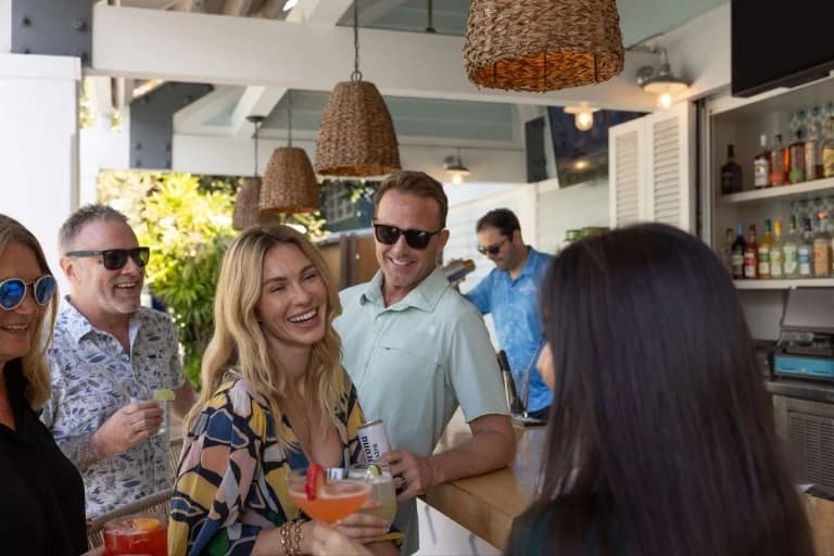 a group of people having cocktails