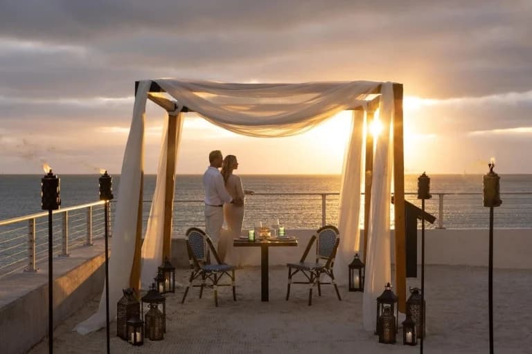 couple at sunset holding hands