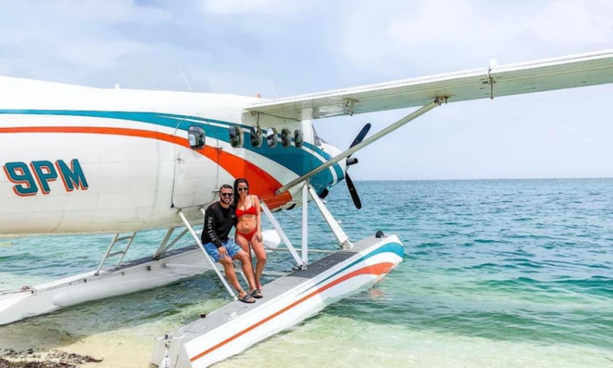people next to small plane
