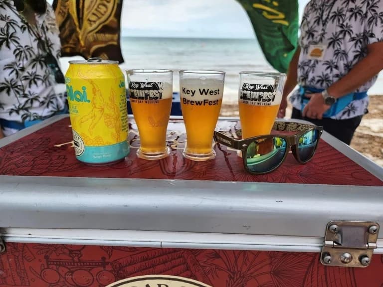 four beers on a cooler