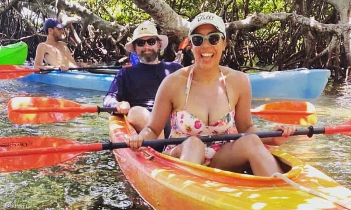 people kayaking down the river