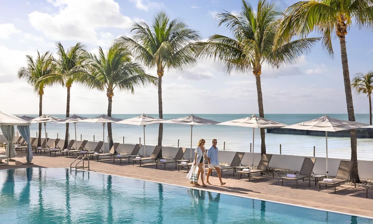Couple walking the pool at resort
