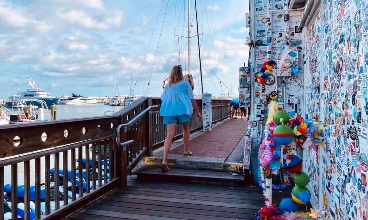 woman climbing stairs by harbor