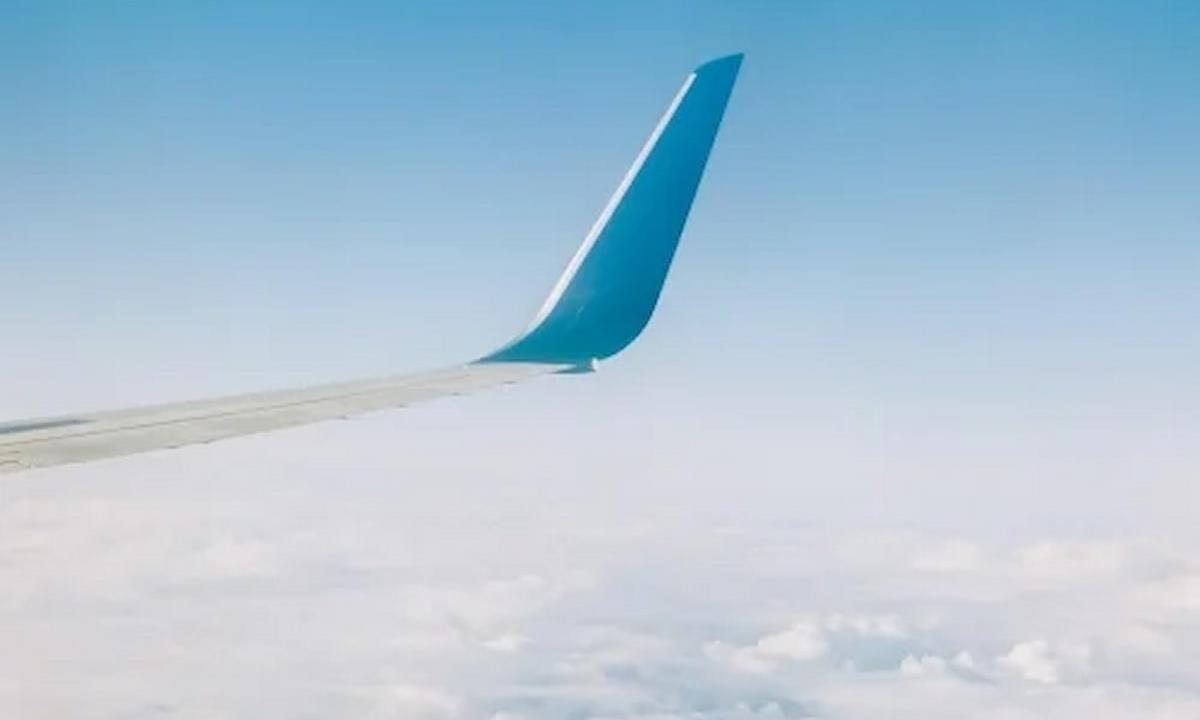 Airplane wing in the sky