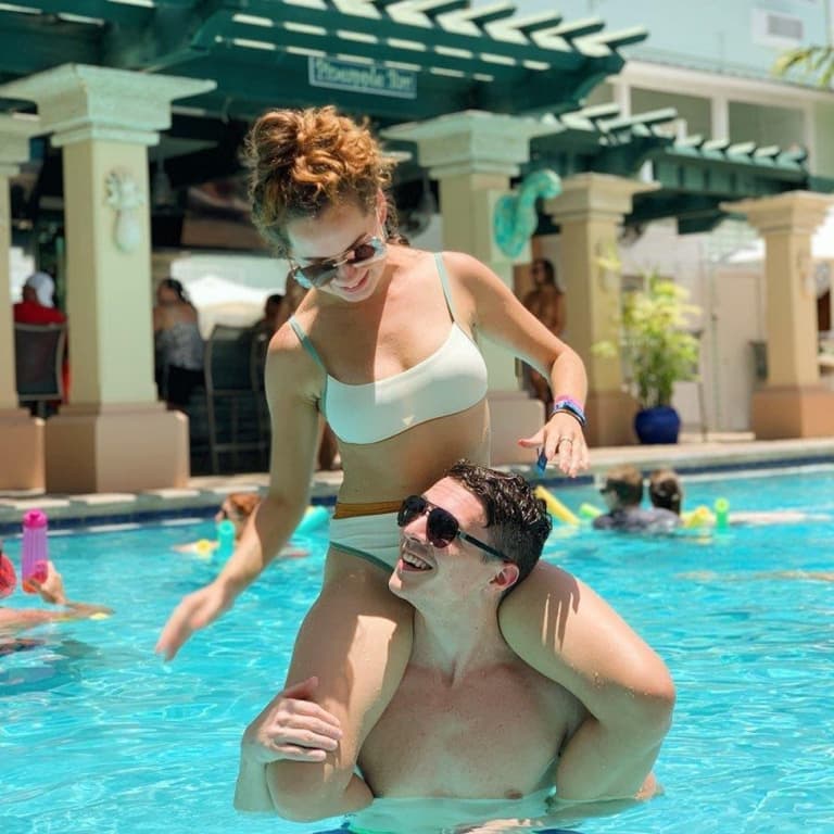 couple playing in pool
