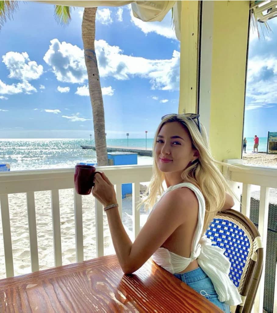 lady drinking on balcony