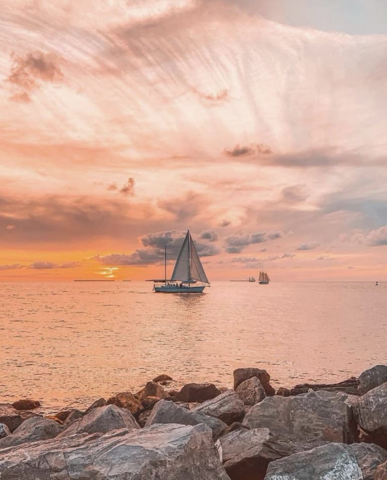 sail boat on the water at sunset