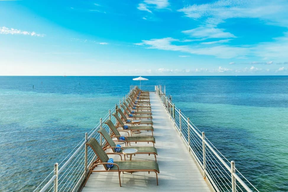 pool chairs by ocean