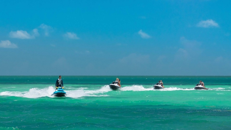 people riding on jetski