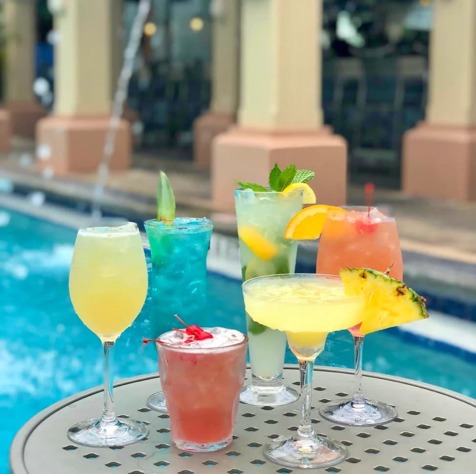 bunch of cocktail poolside