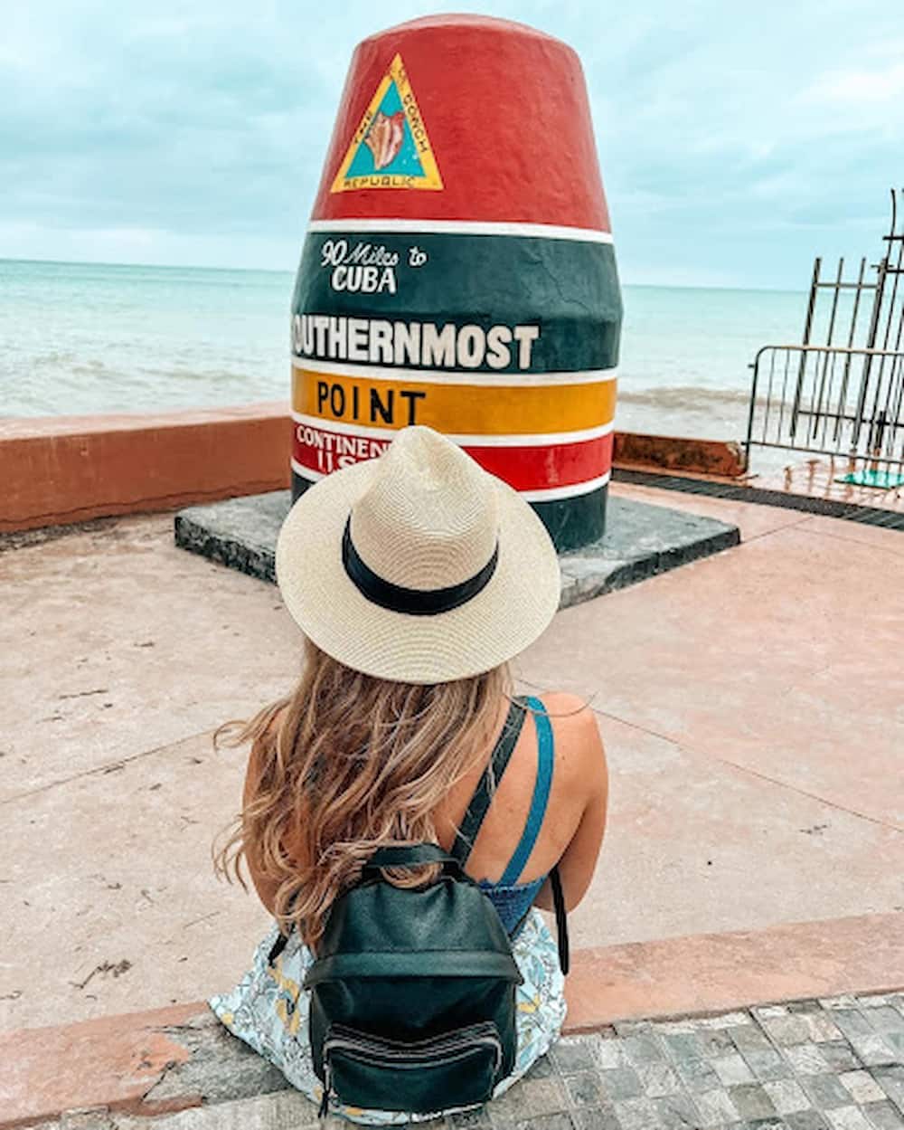 woman next to buoy marker