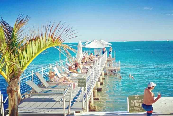 pool chairs by ocean