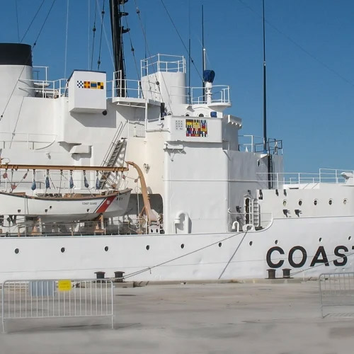 Coast Guard Cutter Ingham boat at a dock. 