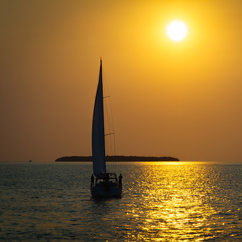 Sailboat during sunset. 