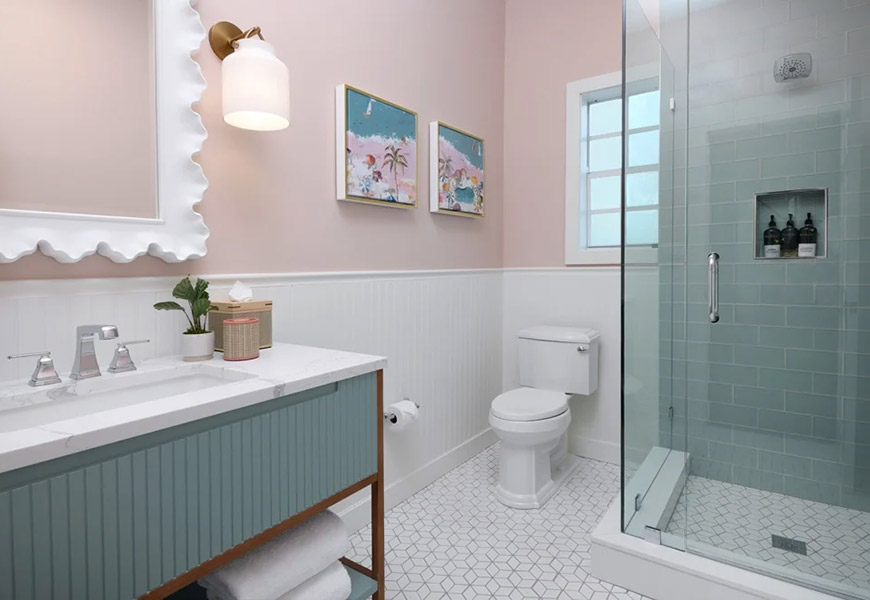 A clean and modern bathroom with a shower, toilet, and sink