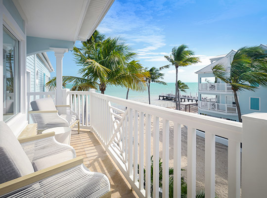 Balcony chair overlooking ocean.